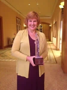 picture of Britt Andreatta with the CLO Award