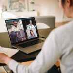 Businesswoman at home having a video conference with her team stock photo