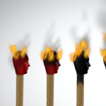 An image of burning match sticks