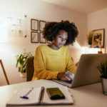 image of a young woman working at home